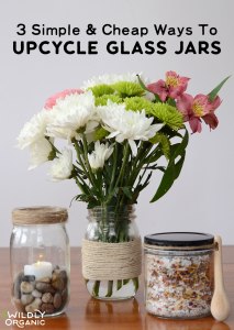 Bouquet of flowers in a jar, a candle jar with stones, and a jar of food ingredients with text Upcycle Glass Jars