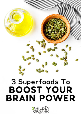 Oil jug, bowl of seeds, and text 3 Superfoods To BOOST YOUR BRAIN POWER on a white background.