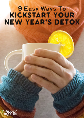 Hands holding a white mug with a lemon slice, with text easy ways to kickstart your new year detox