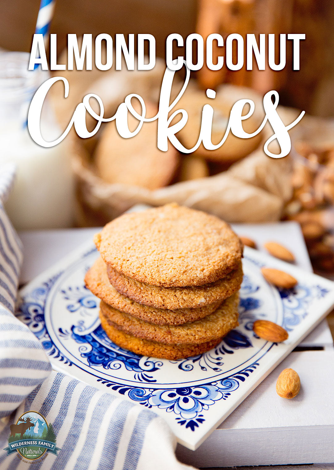 A stack of almond coconut cookies on a decorative plate with almonds scattered around