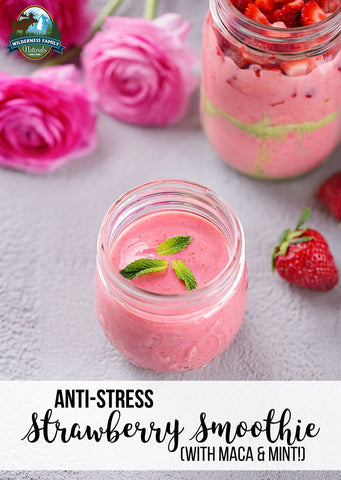 Strawberry smoothie in a jar garnished with mint, with text ANTI-STRESS Strawberry Smoothie (WITH MACA & MINT)