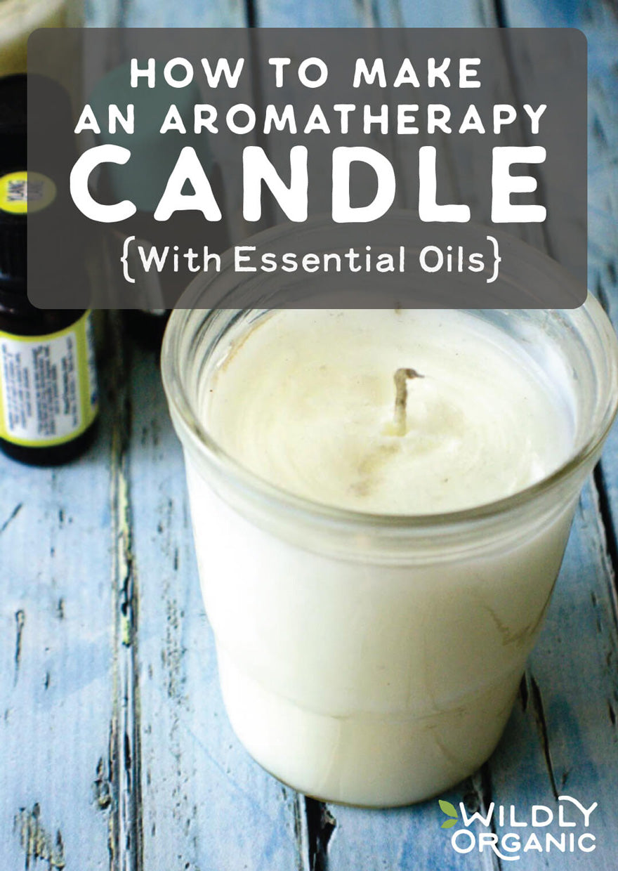 DIY aromatherapy candle with essential oils on a blue wooden surface, labeled How to Make an Aromatherapy Candle.