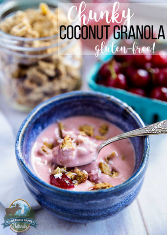 Bowl of pink yogurt with chunky coconut granola and red cherries, with gluten-free text overlay.