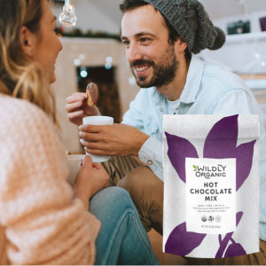 Couple smiling enjoying organic hot chocolate