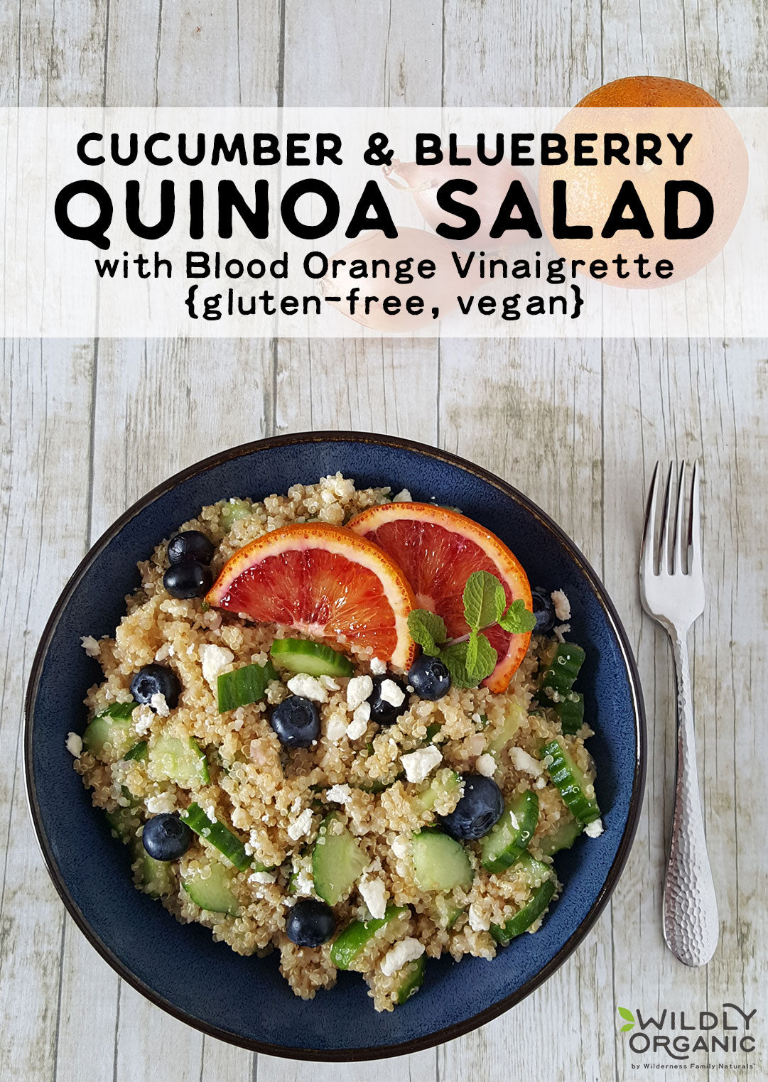 Quinoa salad with cucumber, blueberries, and blood orange slices, labeled as gluten-free and vegan.