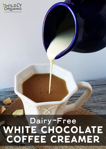 Milk being poured into a coffee mug with text Dairy-Free WHITE CHOCOLATE COFFEE CREAMER
