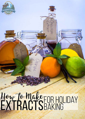 Bottles of homemade extracts labeled vanilla, orange, and chocolate, surrounded by citrus fruits and spices