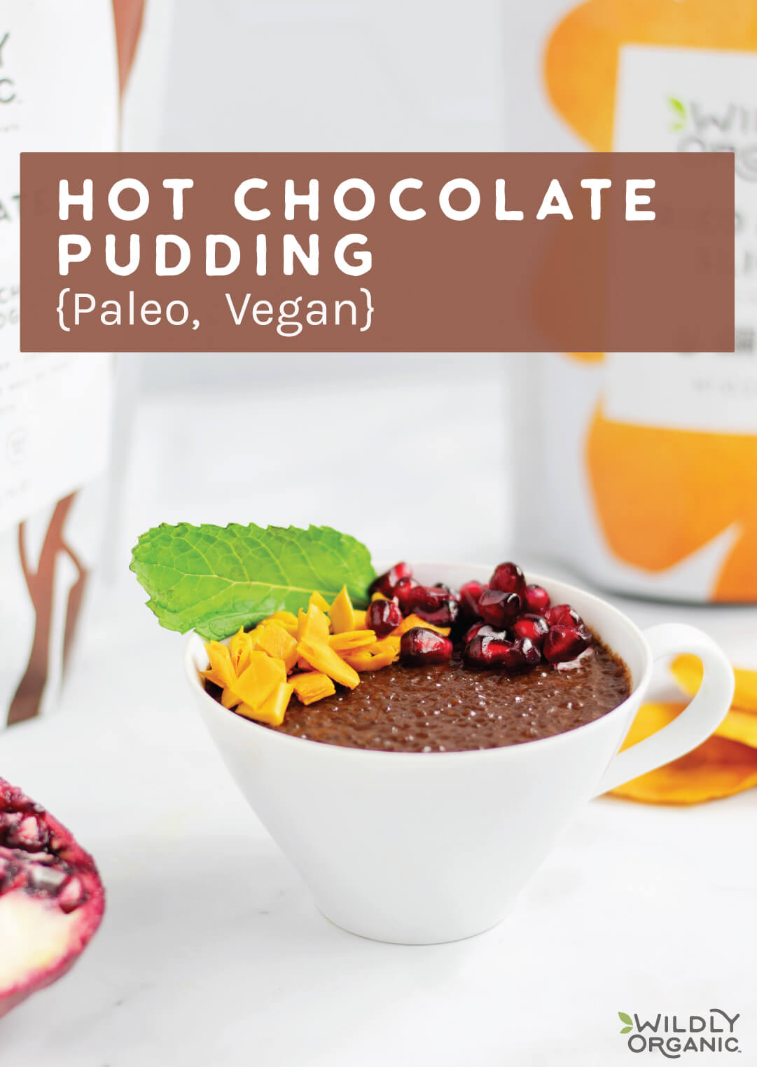 Hot chocolate pudding in a modern whote mug with a blurred background featuring Wildly Organic dried mango packaging.