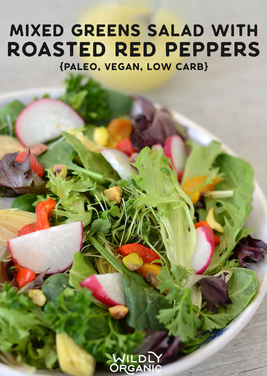 Photo of a bowl of salad in the foreground with salad dressing in the background.