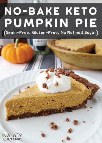 A slice of no bake keto pumpkin pie topped with whipped cream.