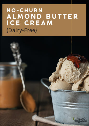 Almond butter ice cream in a metal container with coconut syrup poured on top