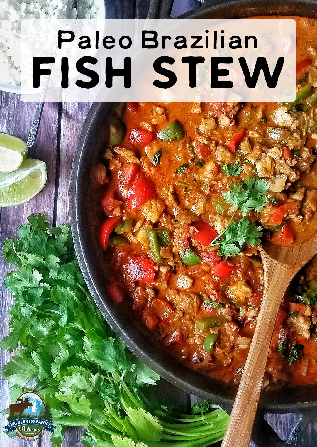 A vibrant Brazilian fish stew with tomatoes and peppers, garnished with cilantro, beside fresh limes