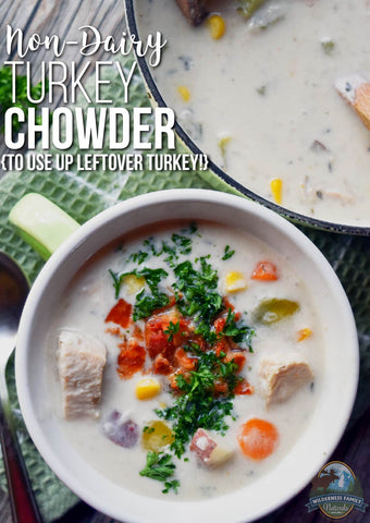 A bowl of non-dairy turkey chowder garnished with herbs and bacon bits