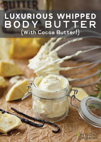 A picture of whipped body butter in a glass jar with hinged lid and a wire beater in background with real vanilla beans and cacao butter in foreground.