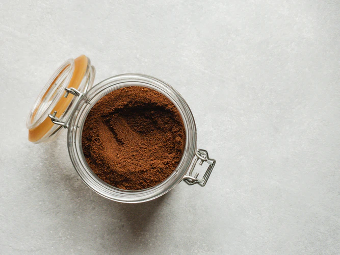 Brown powder inside a glass storage jar