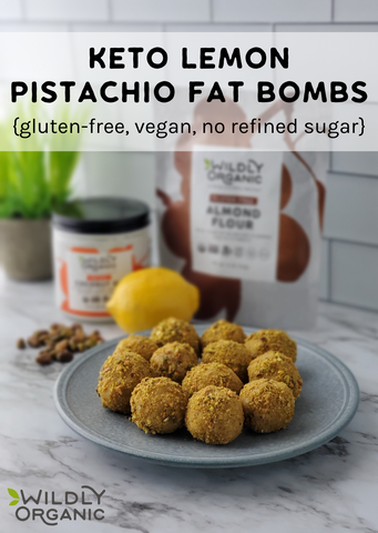 A photo of a plate of keto lemon pistachio fat bombs with a lemon and Wildly Organic Almond Flour in the background.