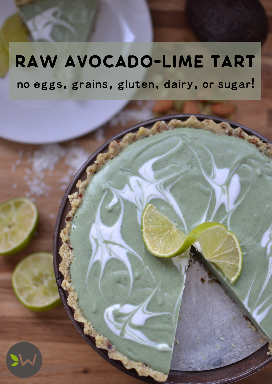 Raw avocado-lime tart with a slice missing, free of eggs, grains, gluten, dairy, and sugar—healthy and refreshing dessert.