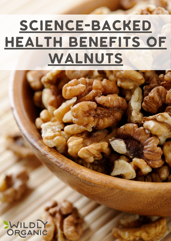 Close up image of walnuts in a bowl with sprinkled walnuts on a table.
