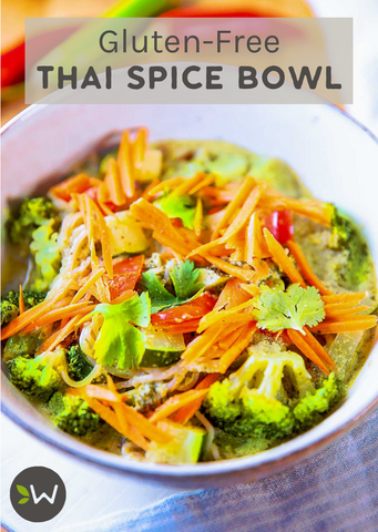 Colorful gluten-free Thai spice bowl with mixed vegetables and garnished with fresh herbs